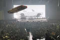 Deloris flying over the audience